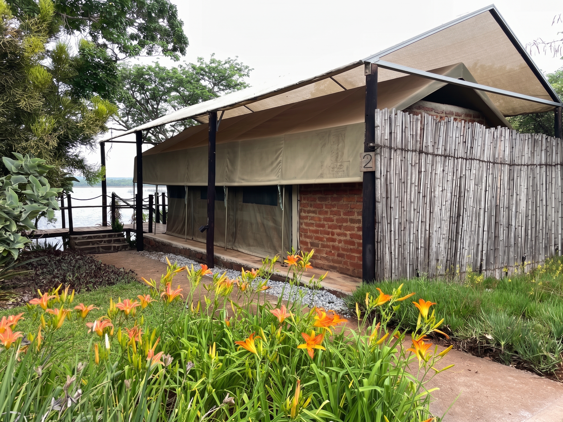 Safari tent and lodge buildings by the lake